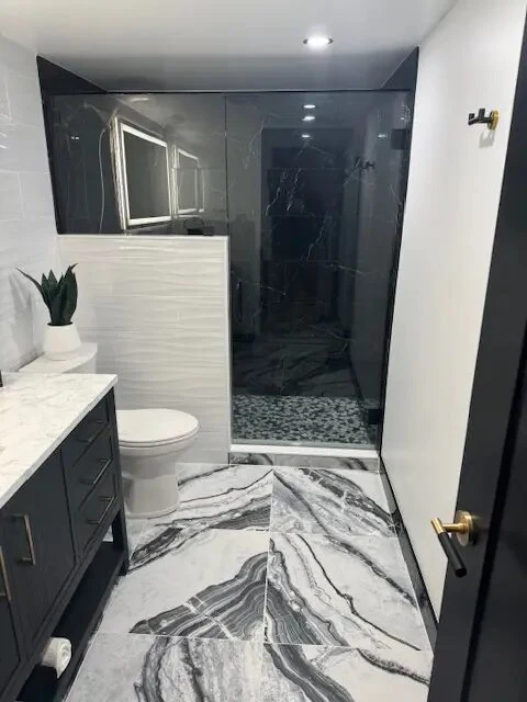 Completed bathroom shower and vanity detailing